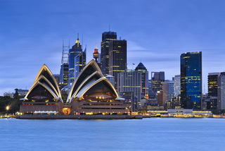 Sydney city CBD landmarks at blue sunset as seen from Kirribilli over harbour